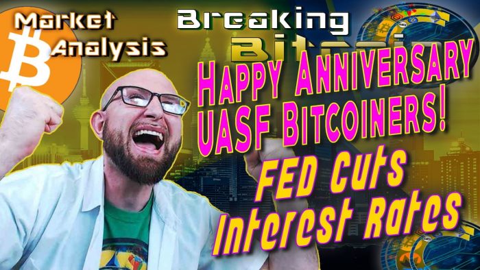 text happy anniversary uasf bitcoiners! FED cuts interest rates net to super happy screaming justin with both fists raised in happy excitement with architecture city skyscraper background graphic and bitcoin logo